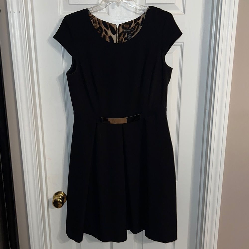 Black and gold fit and flare dress
